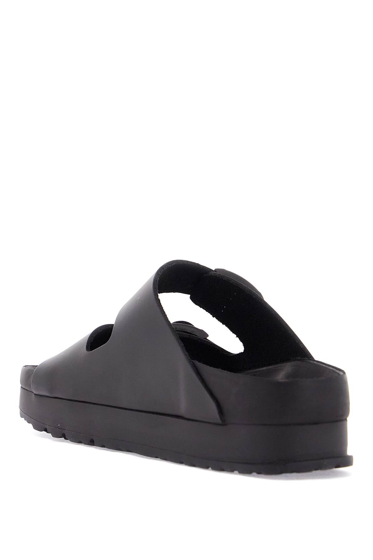 Birkenstock black leather platform sandals with two straps and metal buckles