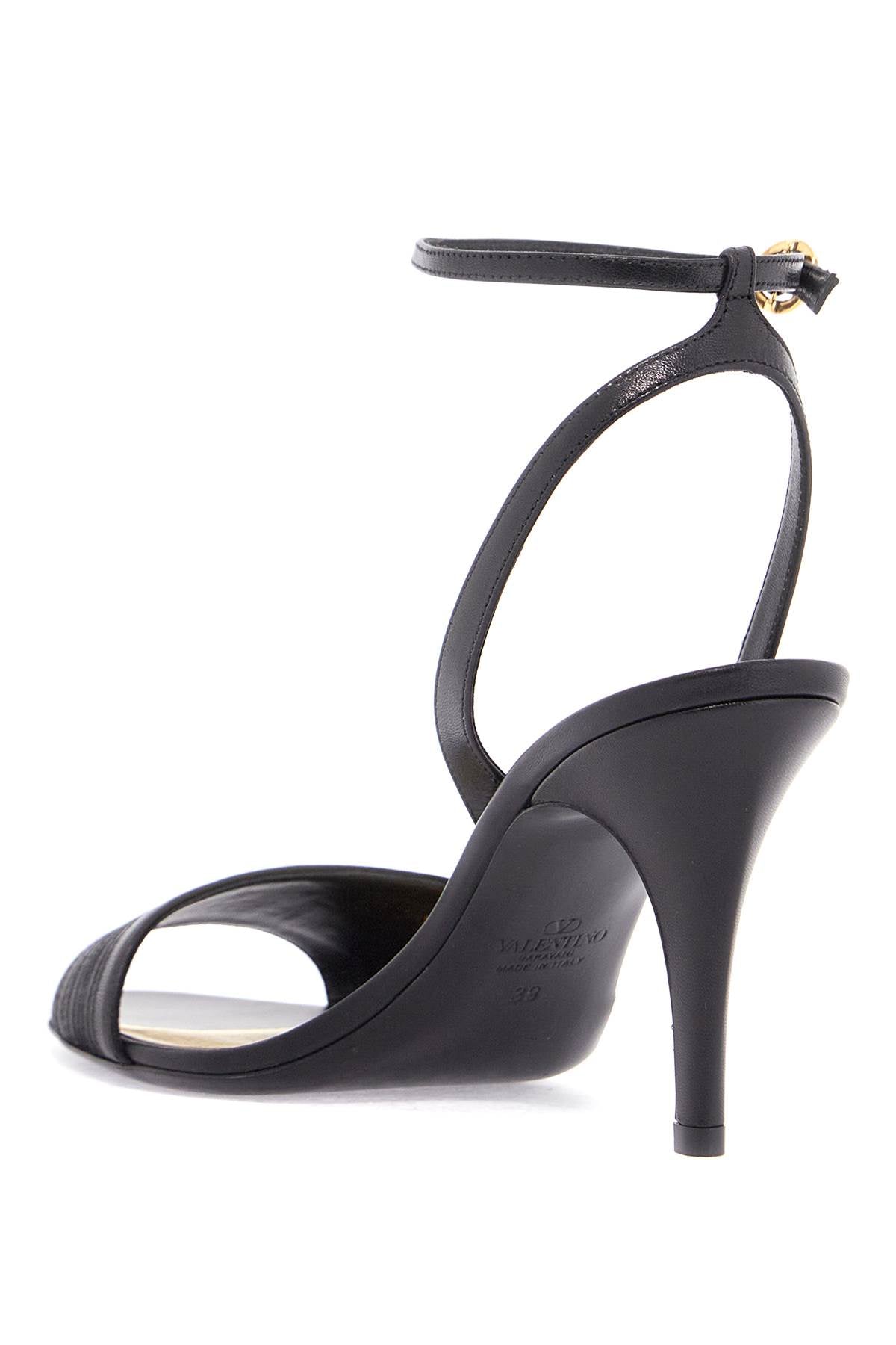 Valentino Garavani black goat leather sandals with gold buckle and stiletto heel